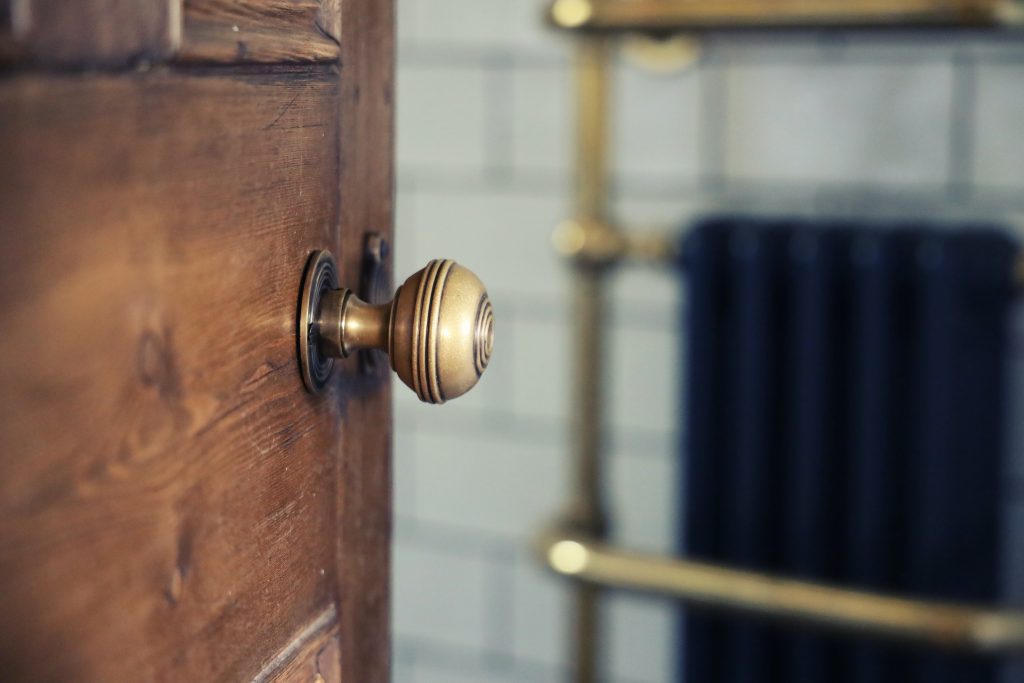 Brass door handle in a bathroom